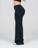 Black wide-leg pants worn by a person on a white background